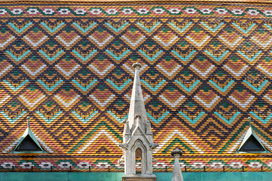 Close-up diamond pattern of glazed colorful Zsolnay ceramic roof tiles covering the roof of Matthias Church in Budapest, Hungary