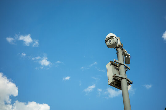 Outdoor CCTV surveillance camera, public safety monitoring, traffic control, smart city security, crime prevention, privacy, and urban infrastructure.