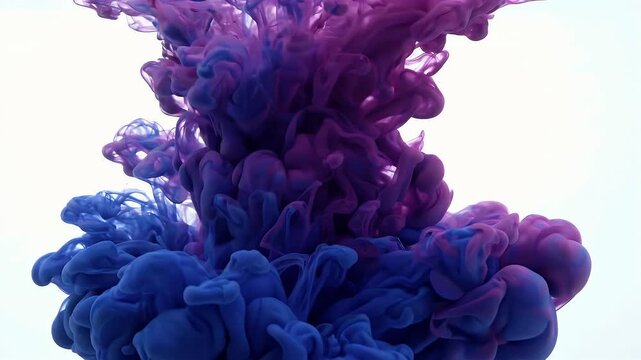 Abstract swirling purple and blue ink dissolving in water creating dynamic fluid motion patterns against a white background