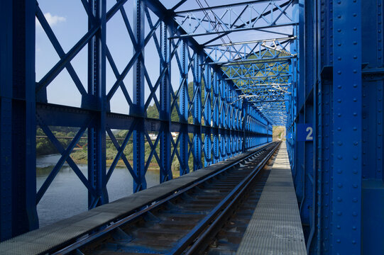 Steel Lattice Railway Bridge Truss and Train Tracks Crossing River