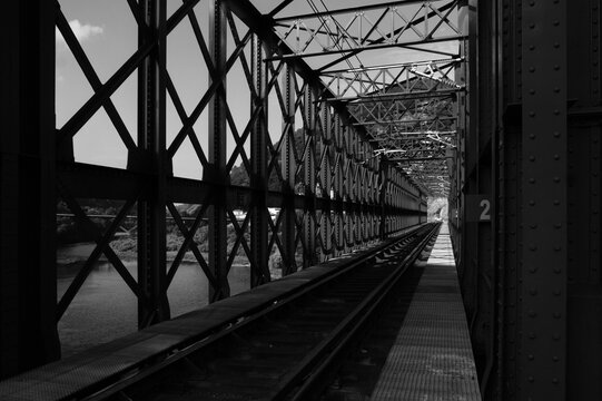 Steel Lattice Railway Bridge Truss and Train Tracks Crossing River
