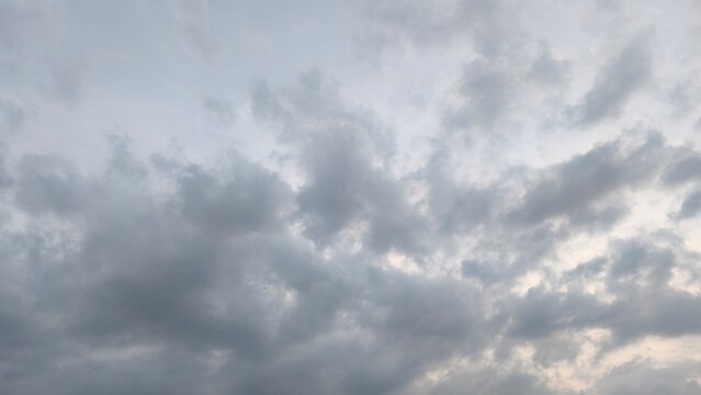 Overcast sky filled with soft grey clouds, creating a dramatic, calm, and moody nature background.
