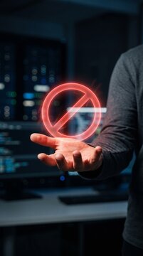 Person holding a glowing red prohibition restriction sign symbol inside a high tech server room