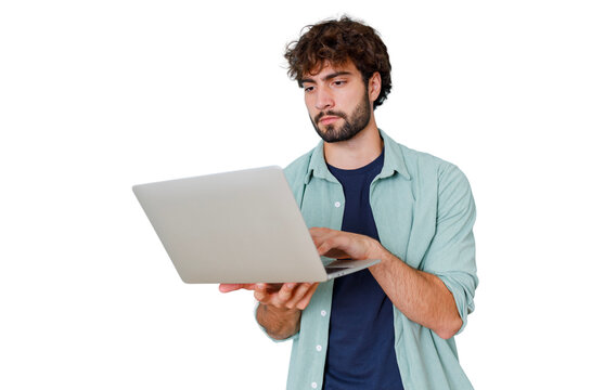 Young man using laptop, working remotely, focused on digital technology and online communication