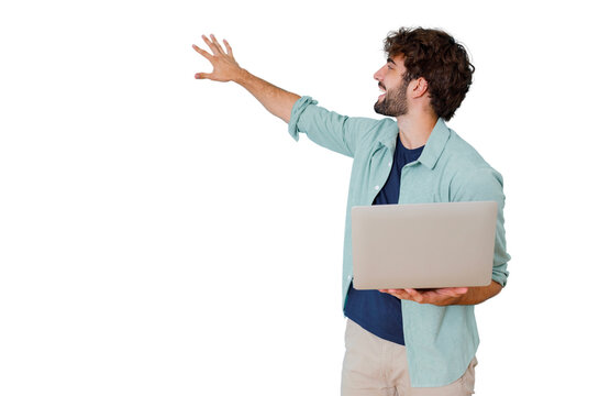 Young man holding laptop reaching out, touching, interacting with virtual screen on transparent background