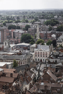 Aerial view of the Mansion House surrounded by historic red-brick rooftops and narrow streets in York, England, United Kingdom.