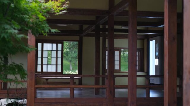 Traditional japanese wooden pavilion in a peaceful green garden