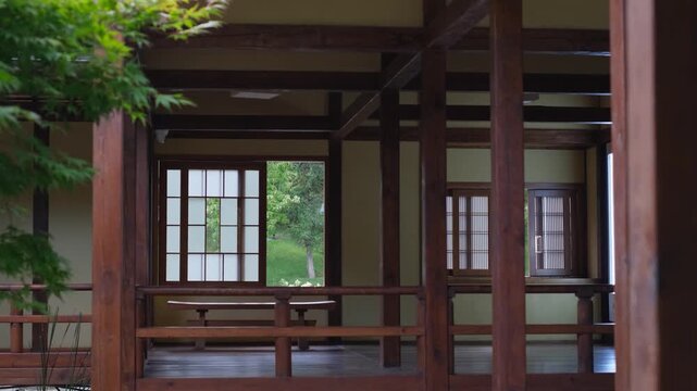 Traditional japanese wooden pavilion in a peaceful green garden