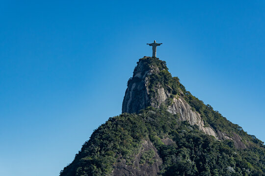 Christ the Redeemer towers over the summit of Corcovado with open arms. Rio de Janeiro, Brazil.