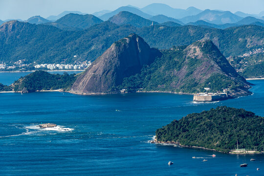 The sweeping view of Guanabara Bay reveals the Santa Cruz Fortress and Fort Tamandar&eacute; da Laje guarding the bay's entrance. Rio de Janeiro, Brazil.