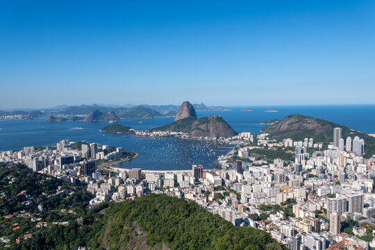 The view from the Dona Marta Lookout reveals Rio de Janeiro, featuring Guanabara Bay, Sugarloaf Mountain, and the city itself. Brazil.