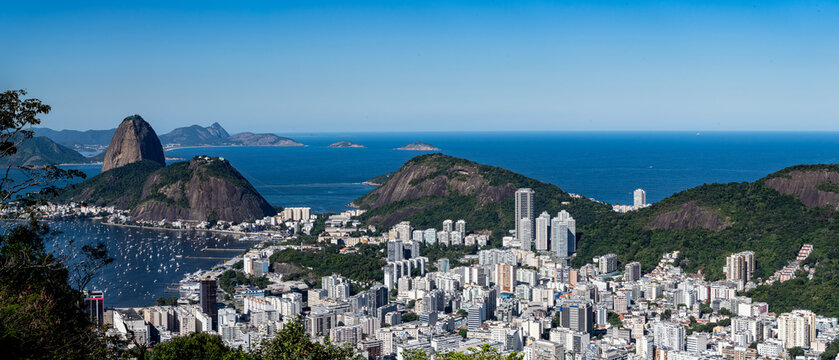The panoramic photo of Rio de Janeiro reveals hills, sea, bay, and city in sweeping layers, highlighting the geography. Rio de Janeiro, Brazil.