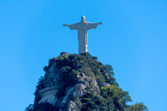 Christ the Redeemer towers over the summit of Corcovado with open arms. Rio de Janeiro, Brazil.