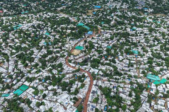 Aerial view of Camp 7 Kutupalang Expansion Sites featuring dense rows of makeshift shelters with white tarpaulin roofs in Cox's Bazar District, Chittagong Division, Bangladesh.