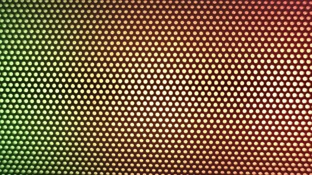 Close-up abstract pattern of a golden-brown honeycomb or perforated metal mesh grill texture.