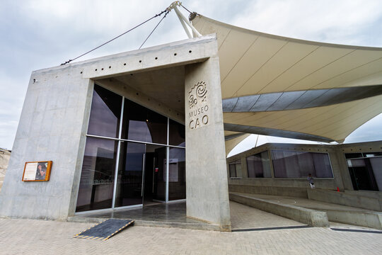 Trujillo, Peru &ndash; January 10, 2024: Exterior facade of the Cao Museum featuring a modern concrete structure and tensile canopy at the El Brujo archaeological complex