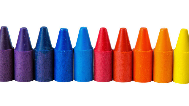 Isolated colorful wax crayons in a vibrant spectrum line for children's art projects