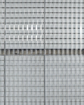 Aerial view of a modern glass building facade with a grid pattern in Aschheim, Bavaria, Germany.