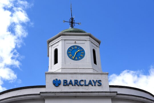 Stratford-upon-Avon, England. 2026.
Barclays Bank. Tower with clock and weathervane. Blue cloudy sky.