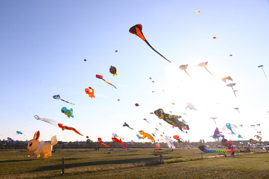 Berlin, Germany - September 27, 2025: Giant kites fill the sky above Tempelhofer Feld during the annual Festival der Riesendrachen, one of Berlin's most popular outdoor autumn events