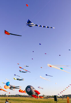 Berlin, Germany - September 27, 2025: Giant kites fill the sky above Tempelhofer Feld during the annual Festival der Riesendrachen, one of Berlin's most popular outdoor autumn events