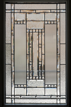 Decorative frosted leaded glass patterns on a door