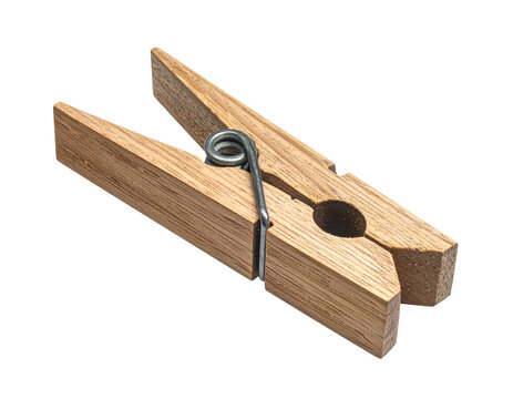 Single wooden clothes peg isolated on a black background for laundry use