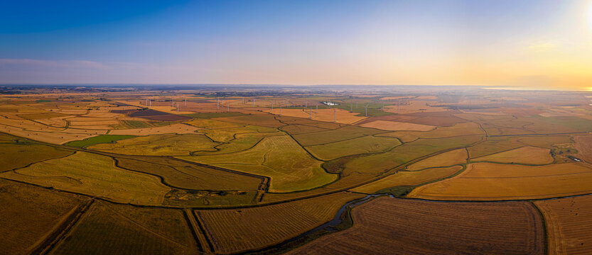 Sussex Wind Turbines at Fiery Sunset Across Rural England Countryside View