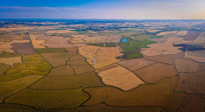 Sussex Wind Turbines at Fiery Sunset Across Rural England Countryside View