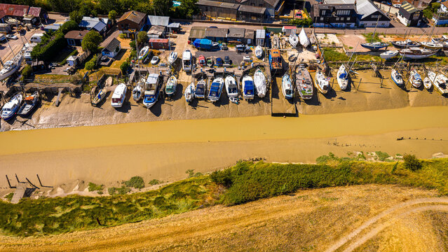 Boats at Low Tide Aerial View in Sussex Estuary and Riverside Boatyard