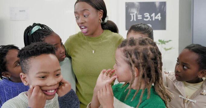 African American teacher leaning in speaking and guiding kids into smiling rows by ?=3