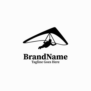 Clean black vector icon of a hang glider pilot gliding through the air, extreme air sports logo on white background