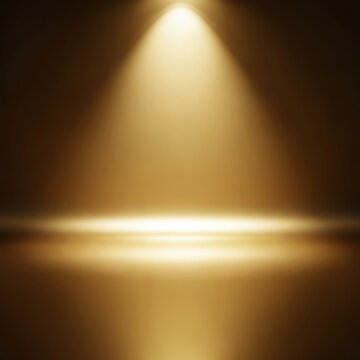 Golden studio background with a centered spotlight shining down onto a reflective horizontal floor surface, creating a stage effect for product presentation and display.