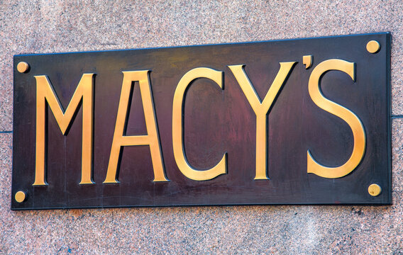 New York City, NY, USA &ndash; June 14, 2026: A close-up view of the historic brass shopfront sign on the exterior of the Macy's Herald Square flagship department store in Midtown Manhattan.