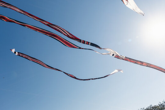 A Janggan kite with a very long tail is flying in the sky over Mertasari Beach, Bali, Indonesia, on July 25, 2026