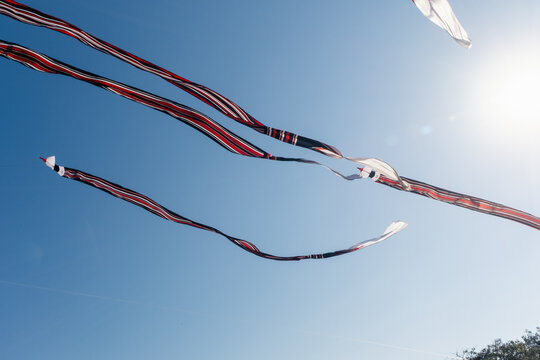 A Janggan kite with a very long tail is flying in the sky over Mertasari Beach, Bali, Indonesia, on July 25, 2026