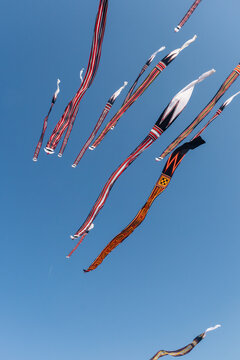 A Janggan kite with a very long tail is flying in the sky over Mertasari Beach, Bali, Indonesia, on July 25, 2026
