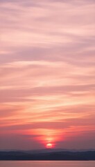 Obraz premium Sunset over distant mountains with colorful sky
