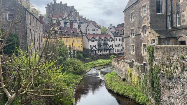 Static view of Dean Village in Edinburgh, Scotland, featuring historic riverside buildings along the Water of Leith in a charming and picturesque setting.
