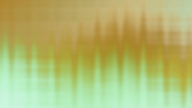 Soft golden and green gradient background with smooth blurred light waves and glowing transitions. Ideal for motion graphics, presentations, digital backdrops, modern visual effects.