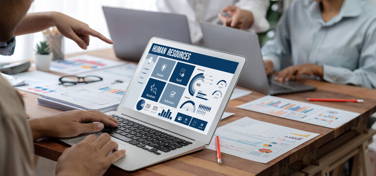 Human resources management software on computer screen helping human resources employee to manage recruitment, payroll, staff searching and KPI evaluation brisk