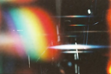 Fototapeta premium Diagonal rainbow prism light rays refracting on dark surface overlay.