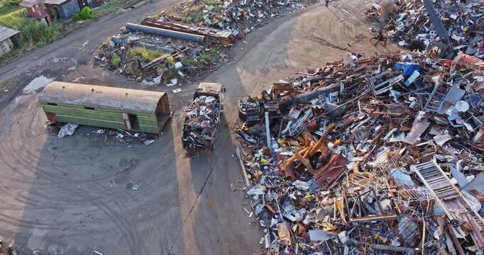 Aerial View of Truck Transporting Scrap Metal from Industrial Recycling Yard