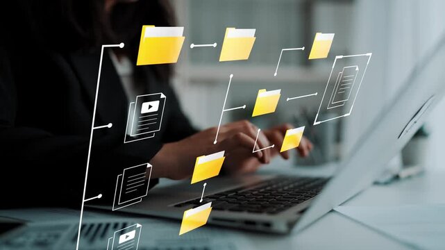 Modern office workspace with hands typing on laptop and digital file management concept presenting folders and documents in a creative layout Gluon.