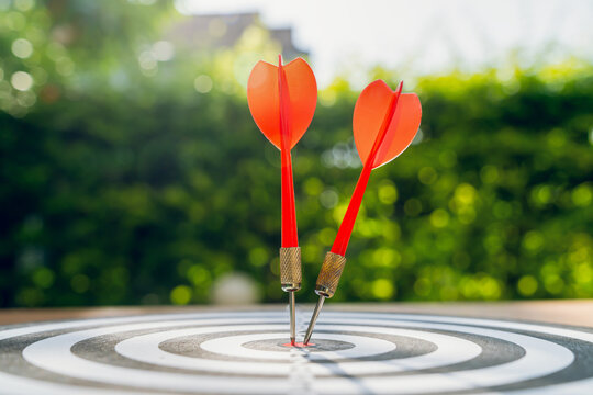 Dart in bullseye of dartboard, concept for business target planning growth and aim to winner goal.