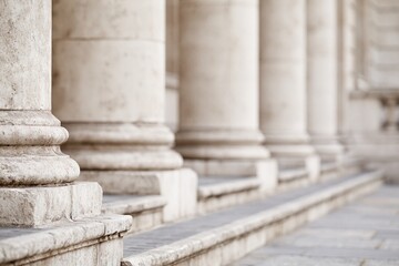 Obraz premium Close-up view of weathered stone columns and steps on a classical building facade showcasing architectural details