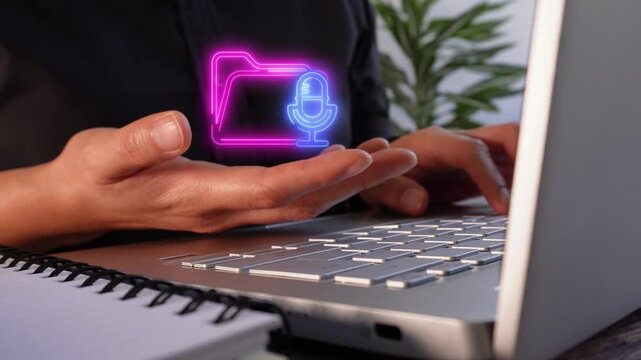 Audio files. Close-up of a businesswoman's hands working on her laptop while holding a virtual folder icon with a microphone.