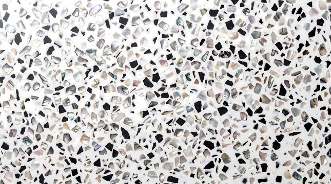 close-up photograph of a luxury terrazzo composite surface featuring iridescent mother-of-pearl flakes and contrasting black aggregate embedded in a smooth white binder.