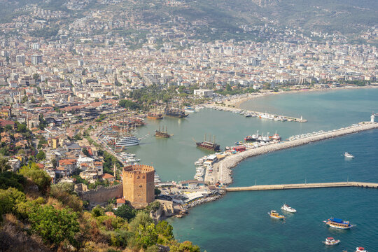 Turkey. Alanya, 24 July 2026. Aerial view from the Citadel of Alanya on the Red Tower (Kizil Kule) and marina