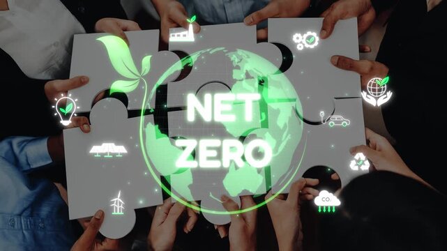 A diverse group of individuals join hands in a cooperative effort to piece together a puzzle symbolizing the global commitment to net zero emissions and sustainable development. Raster